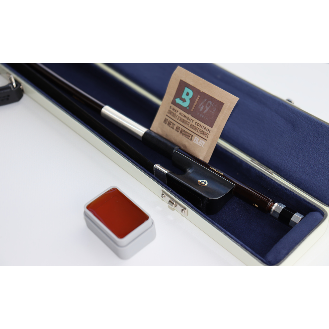 CodaBow marquise in a case with a bored humidity pack and a block of rosin