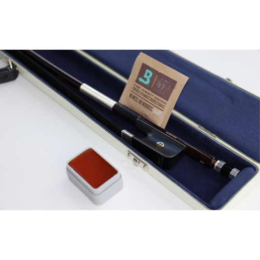 CodaBow marquise in a case with a bored humidity pack and a block of rosin