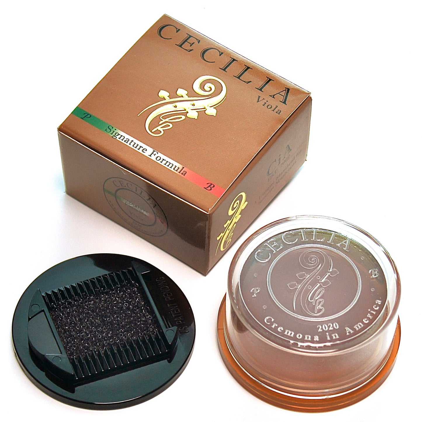 A rosin container sits next to its box.  The container is transparent, showing dark-brown rosin.  The box is brown with gold lettering: "CECILIA Viola Signature Formula."  The box and container feature a stylized viola design.