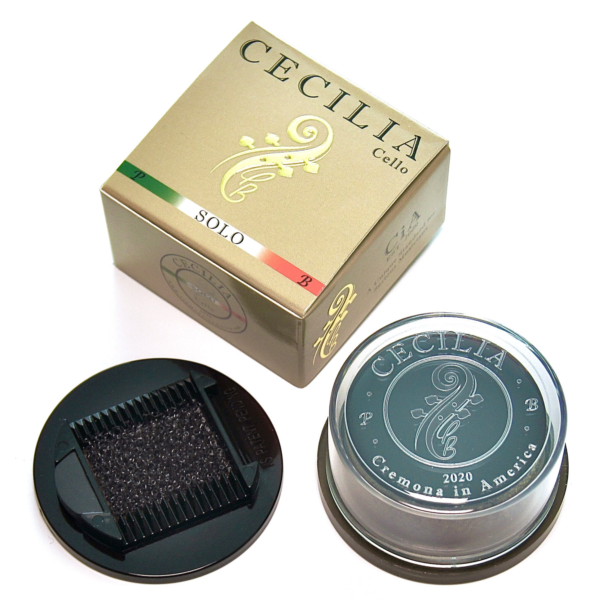 Cello rosin, contained in a clear plastic container with a black base, sits next to its gold and green box.  The box is labeled "CECILIA Cello SOLO".
